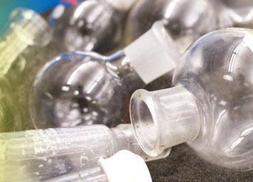 image of flasks and glassware lying on a counter