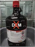 photo of dichloromethane (DCM) bottle with a big X on it