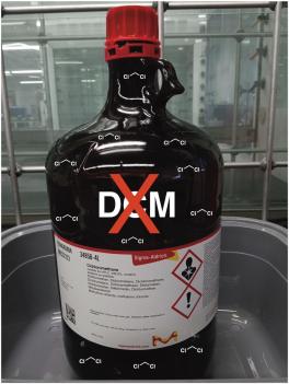 photo of dichloromethane (DCM) bottle with a big X on it